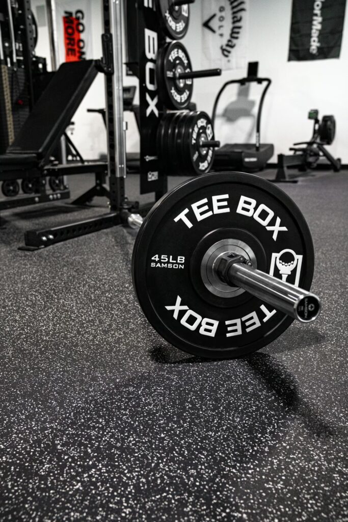 Tee Box golf performance center with custom Samson power rack stations
