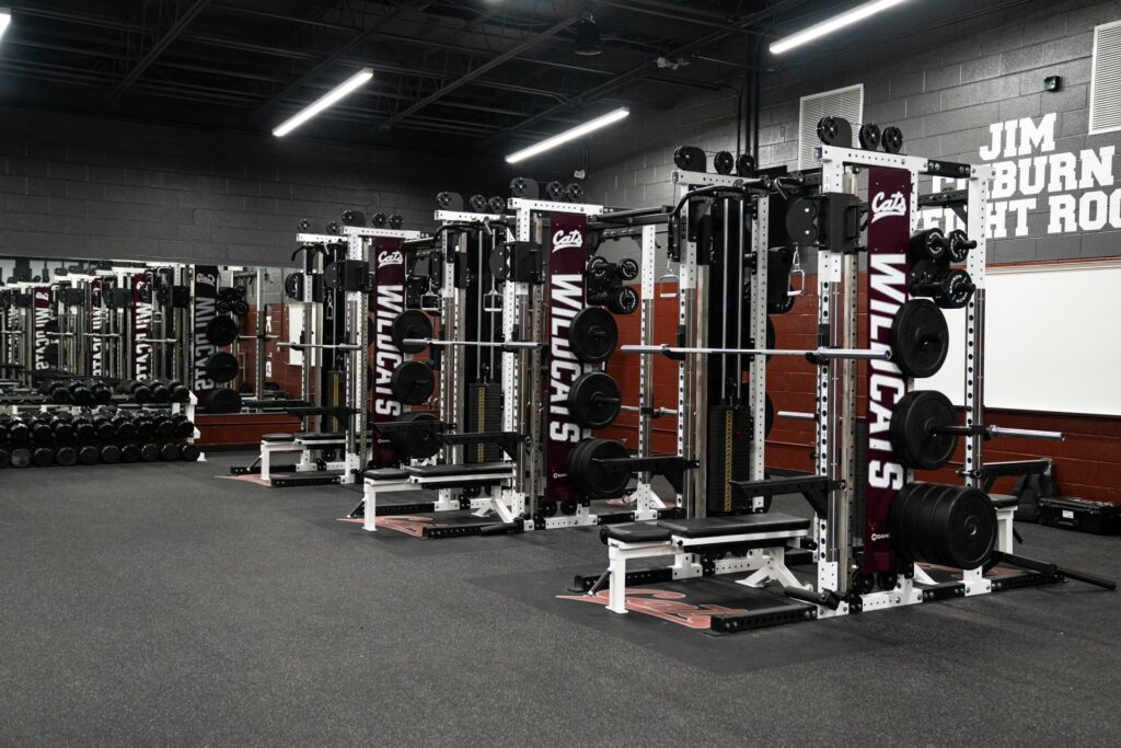 Calallen High School weight room featuring custom logo embedded rubber platforms